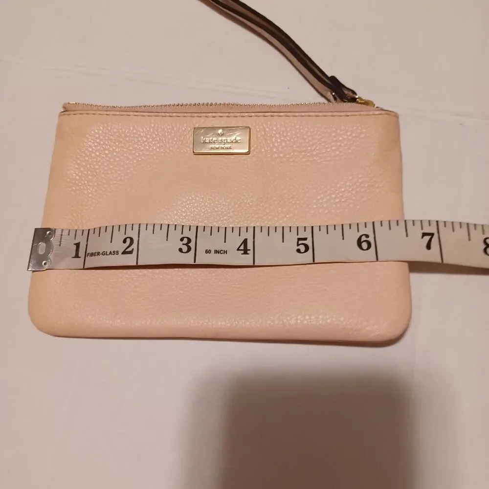 Kate Spade New York Pink Tone Wristlet.
